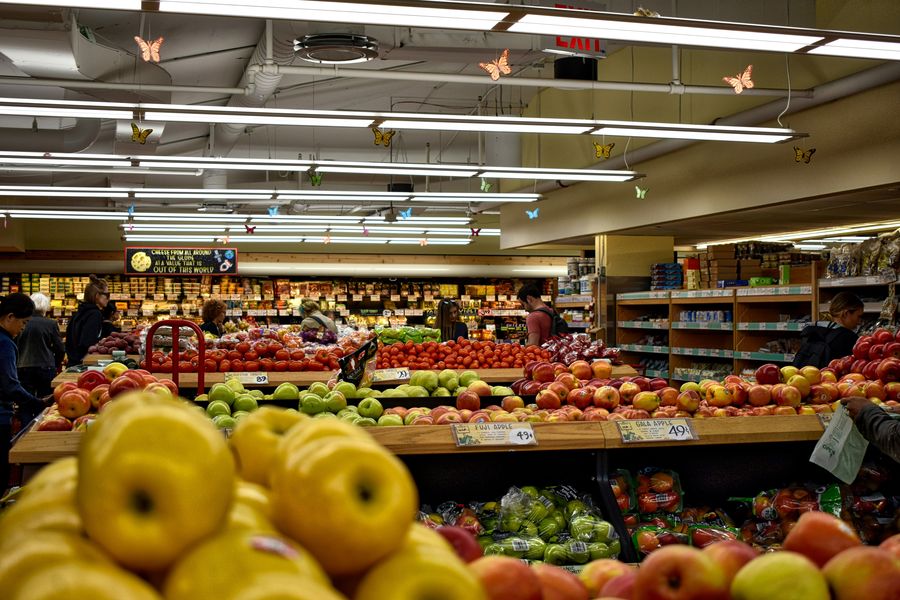 Colorful produce shelves under crisp retail lighting
