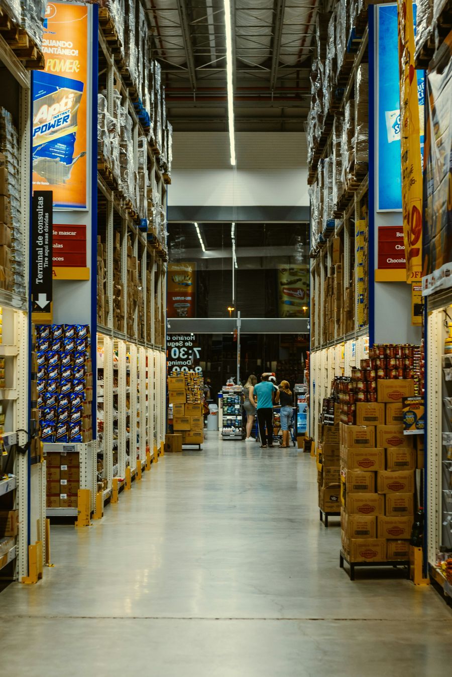 Long retail corridor with evenly spaced ceiling light lines