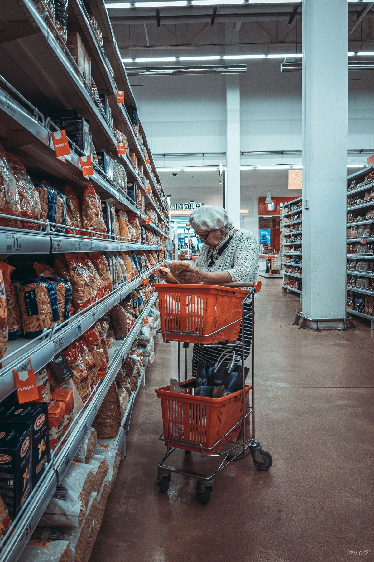 Long supermarket aisle with continuous light lines