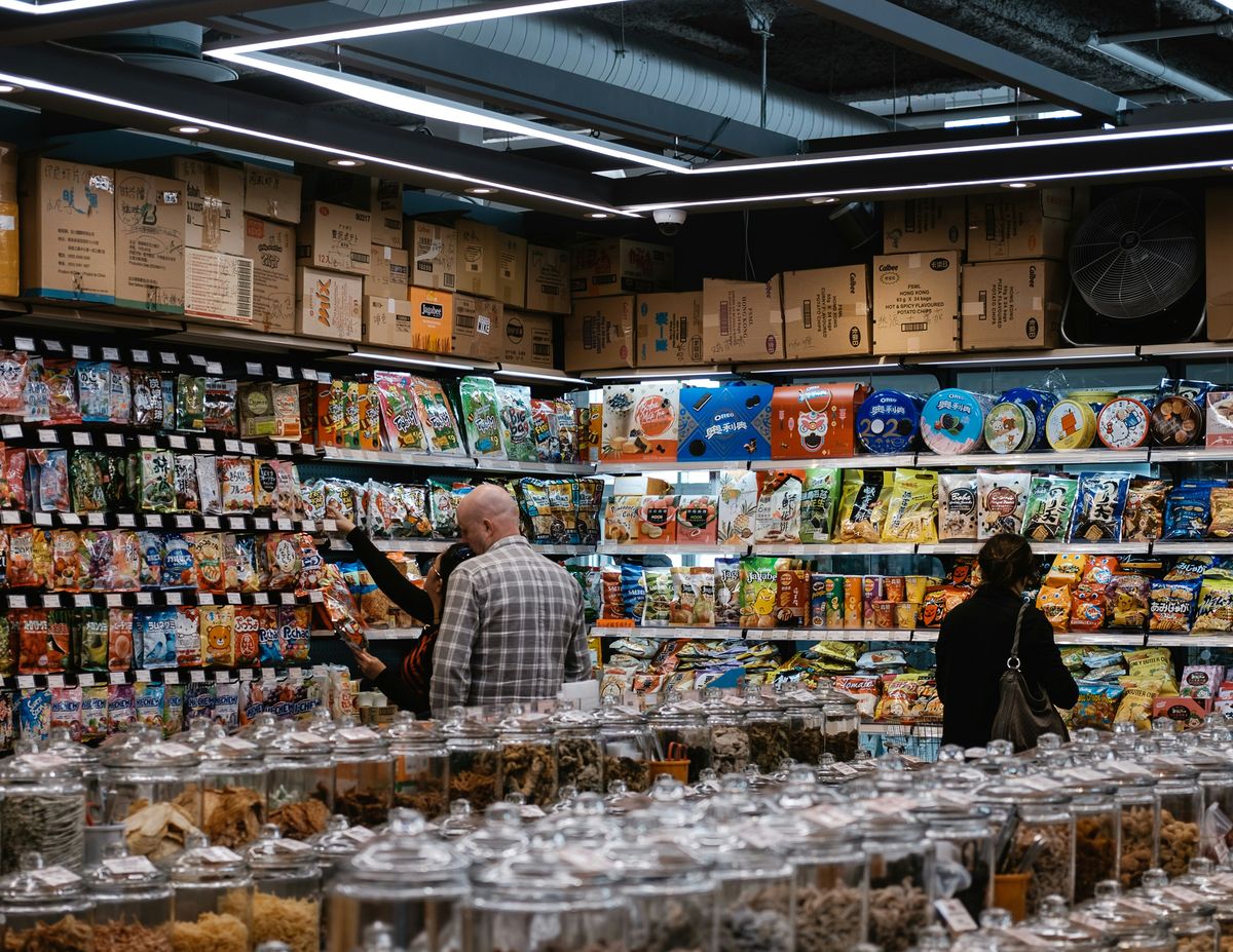 Bulk goods aisle under neutral white lighting